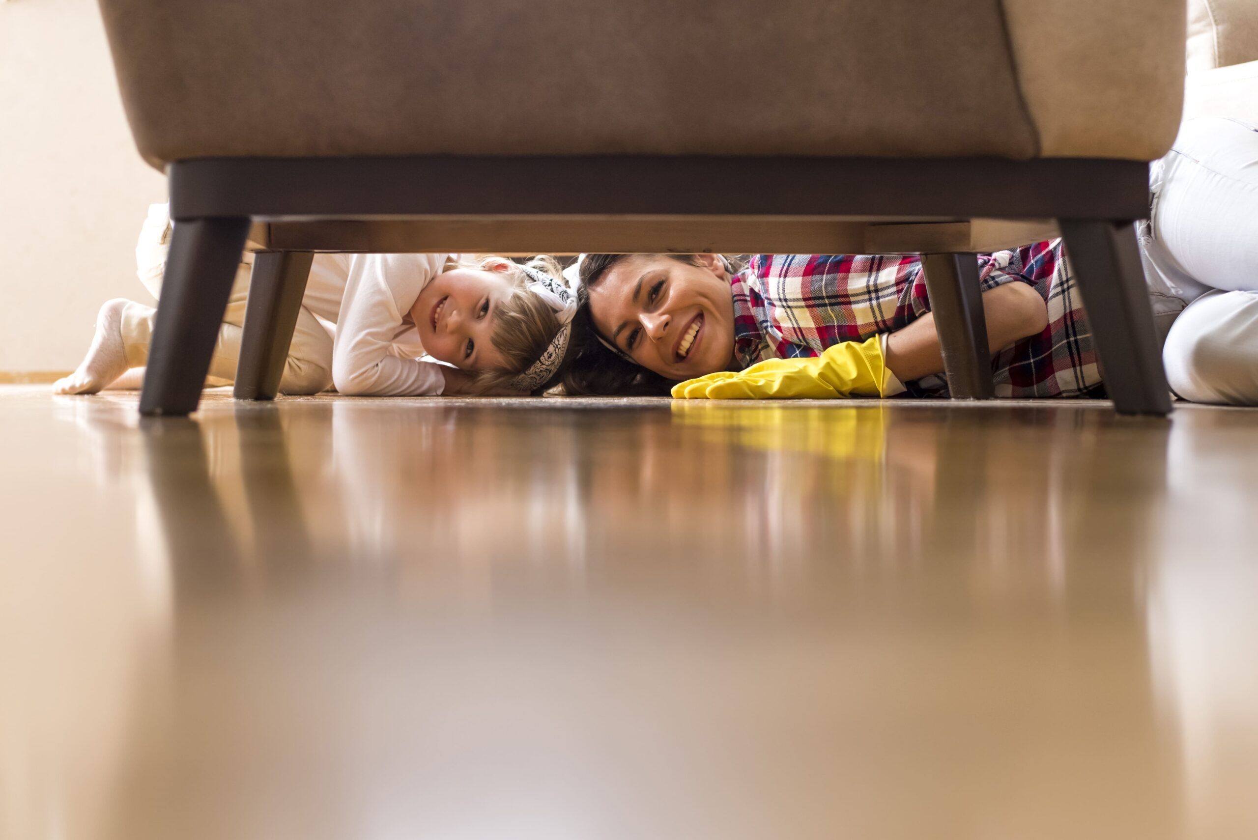 mom and boy clean the home